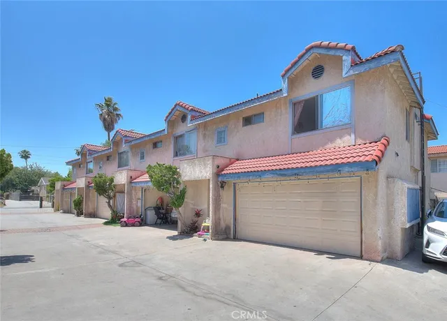 a front view of a house with a garage