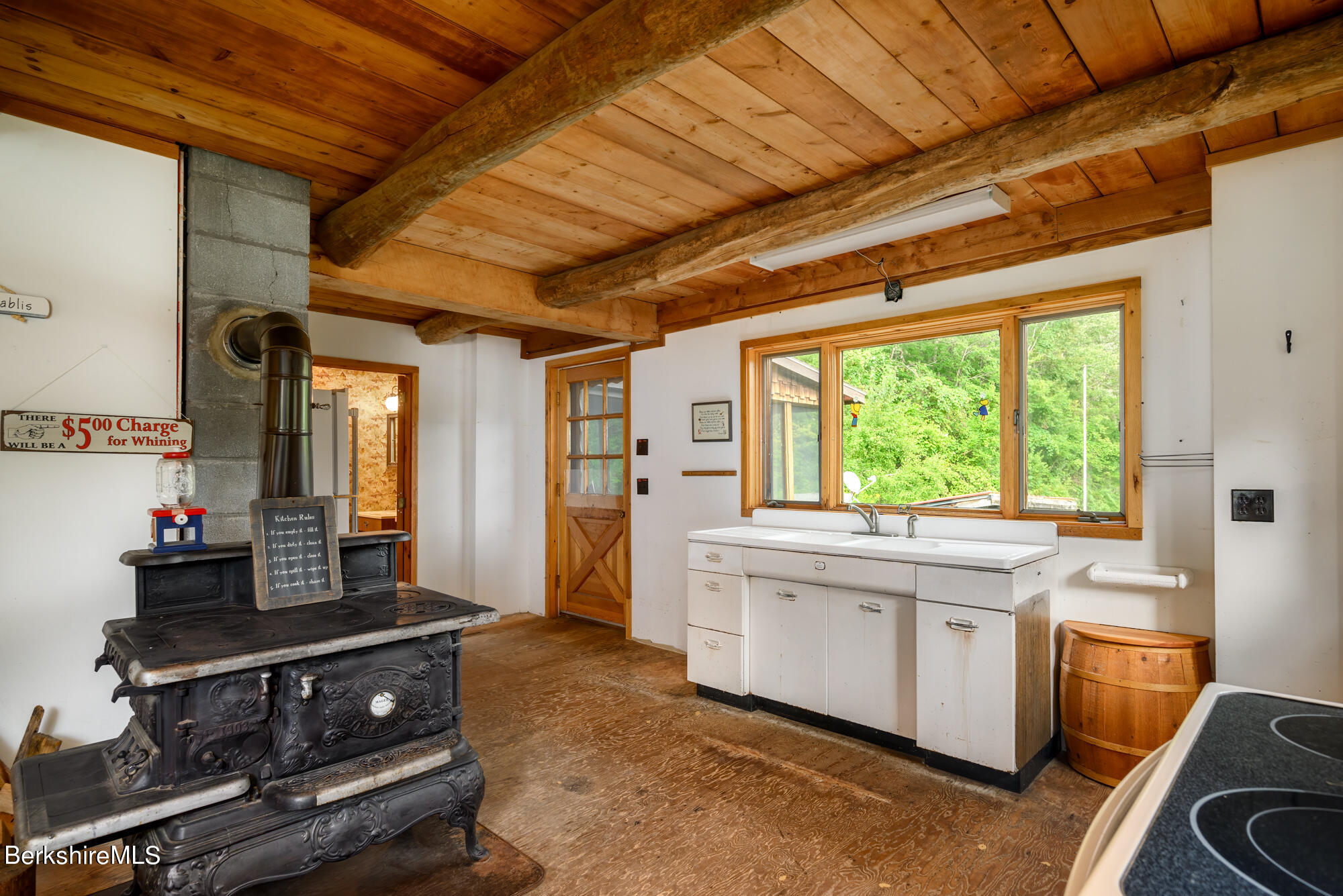 276 Sumner Road Stamford, VT 05352 - Photo 10 of 38 a kitchen with a stove and a sink