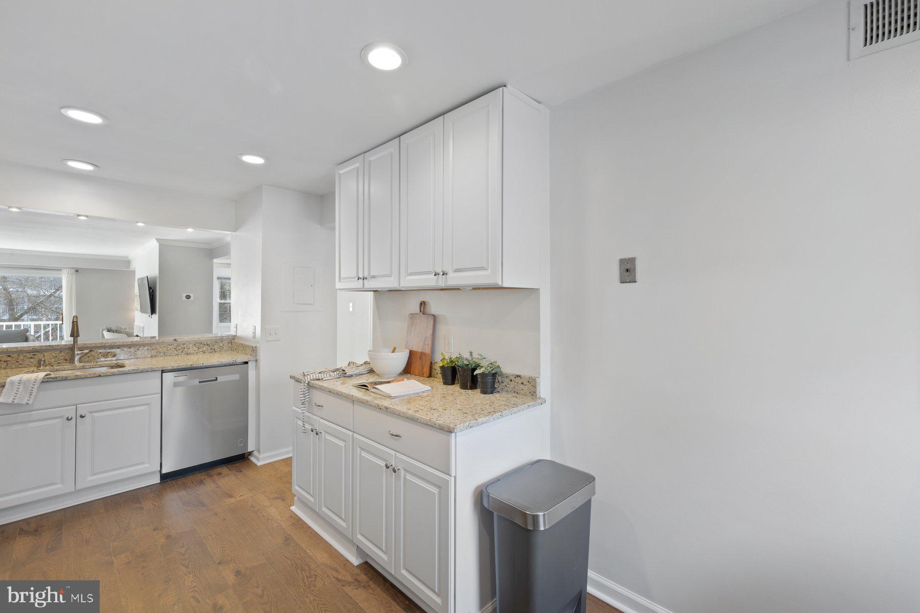 20313 Beaconfield Terrace, Unit 102 Germantown, MD 20874 - Photo 12 of 23 a kitchen with a sink and cabinets