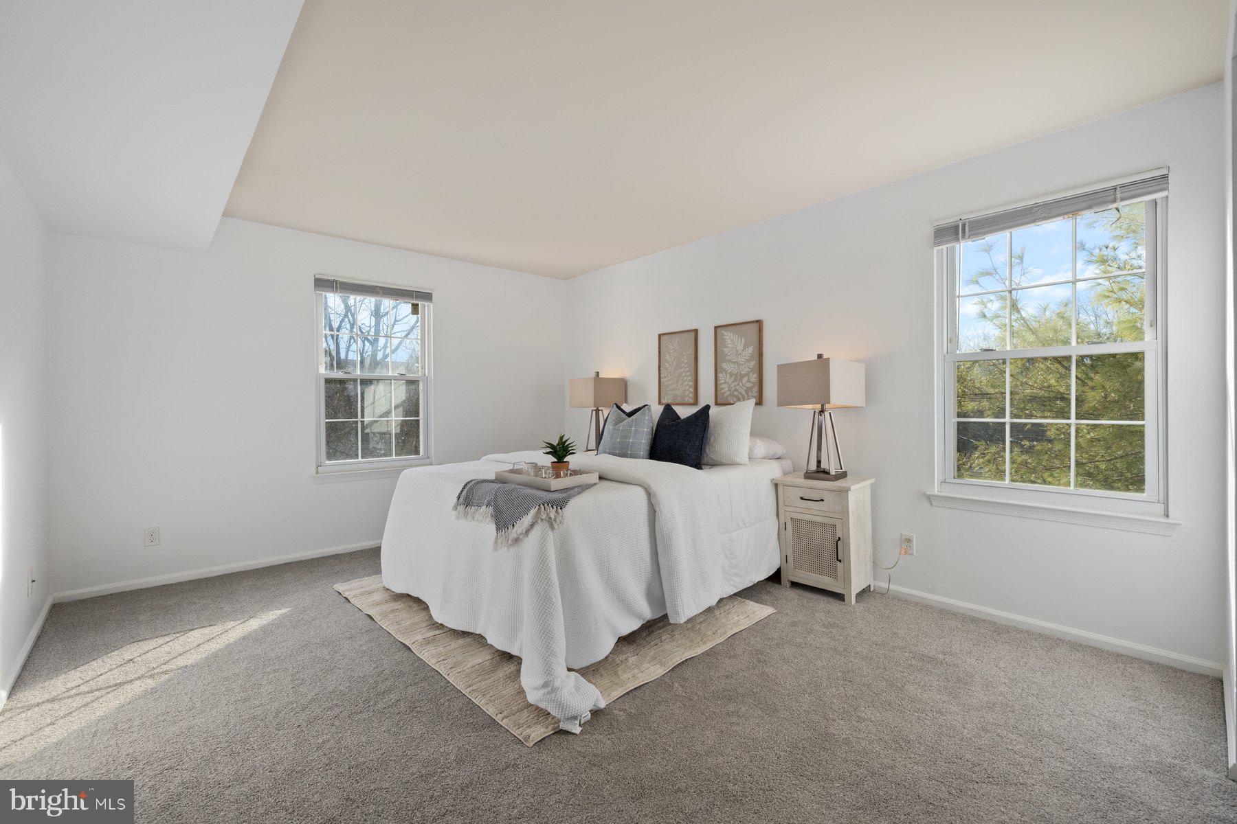 20313 Beaconfield Terrace, Unit 102 Germantown, MD 20874 - Photo 14 of 23 a bed room with a bed and a window