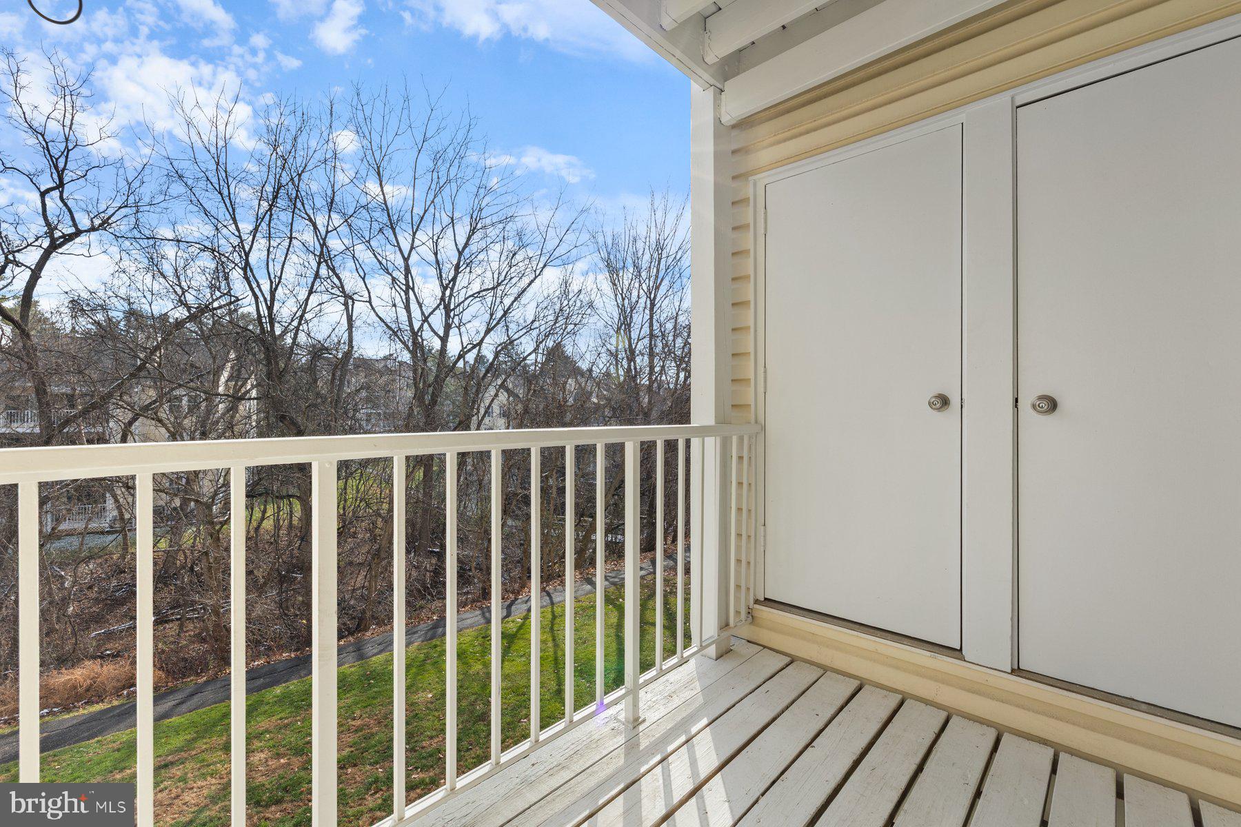 20313 Beaconfield Terrace, Unit 102 Germantown, MD 20874 - Photo 22 of 23 a view of a balcony with wooden floor