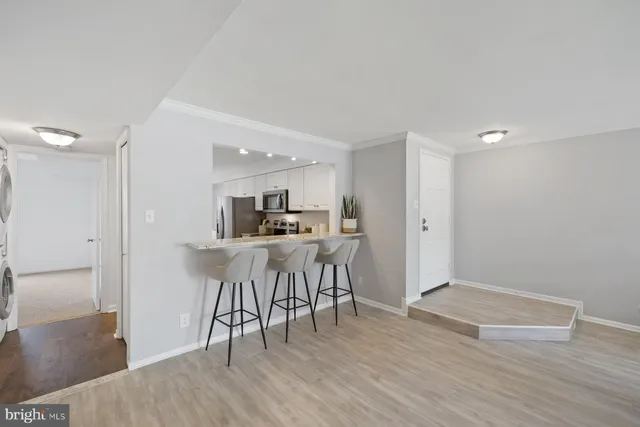 a view of kitchen with furniture and wooden floor