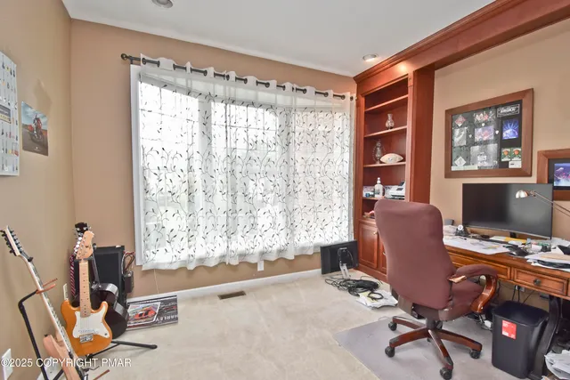 a workspace with furniture and a window