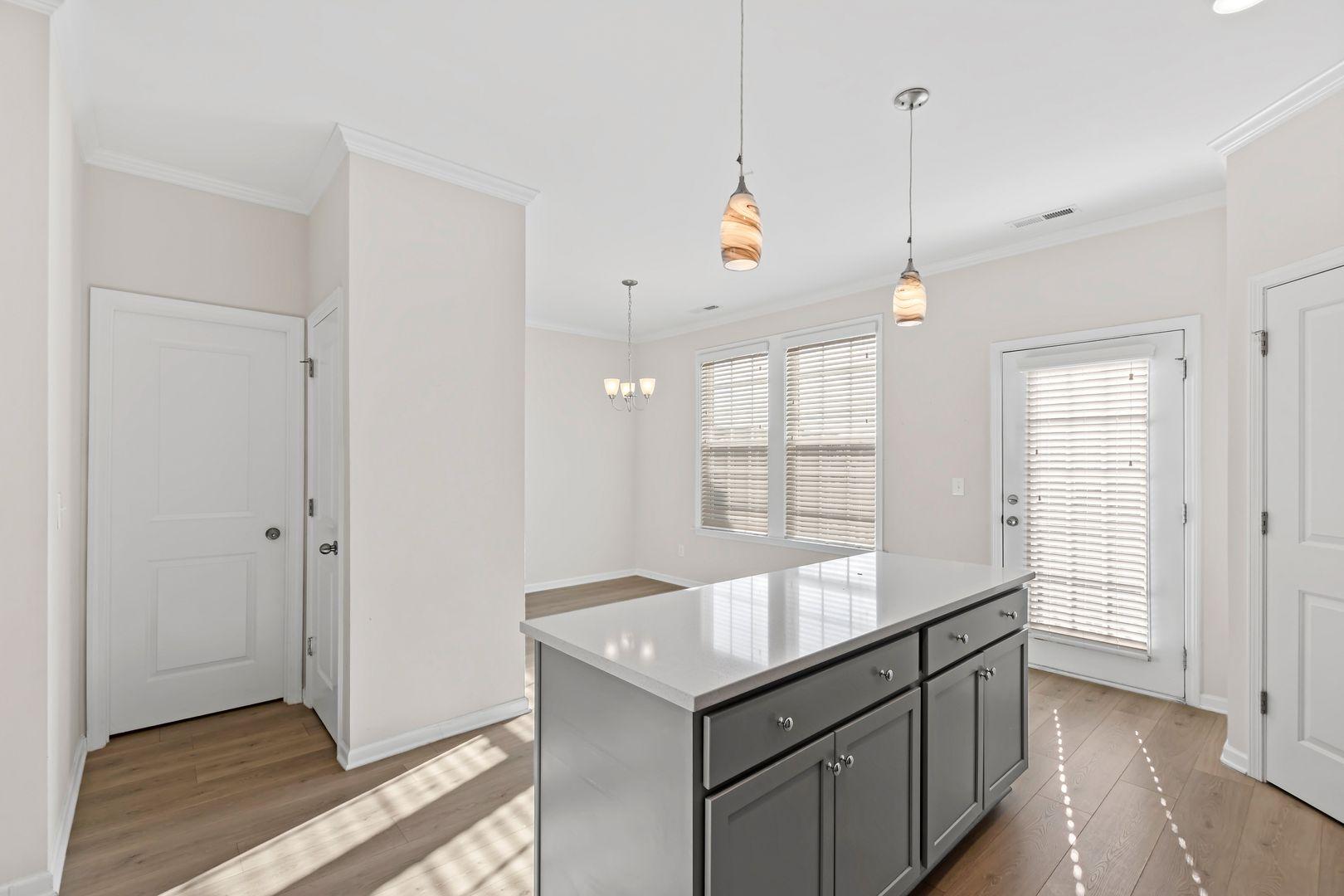 6103 Kayton Street Raleigh, NC 27616 - Photo 13 of 45 a kitchen with granite countertop a sink and a window