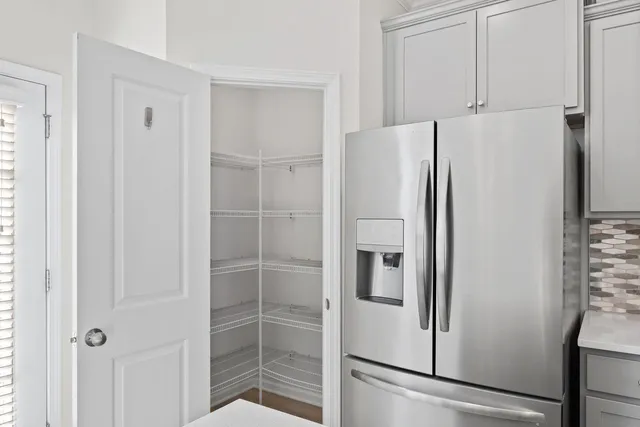a white refrigerator freezer sitting inside of a kitchen