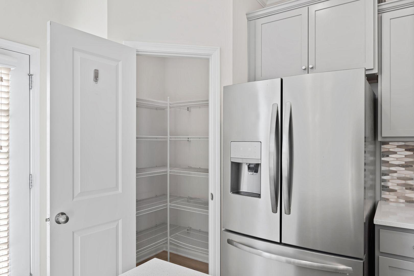6103 Kayton Street Raleigh, NC 27616 - Photo 14 of 45 a white refrigerator freezer sitting inside of a kitchen