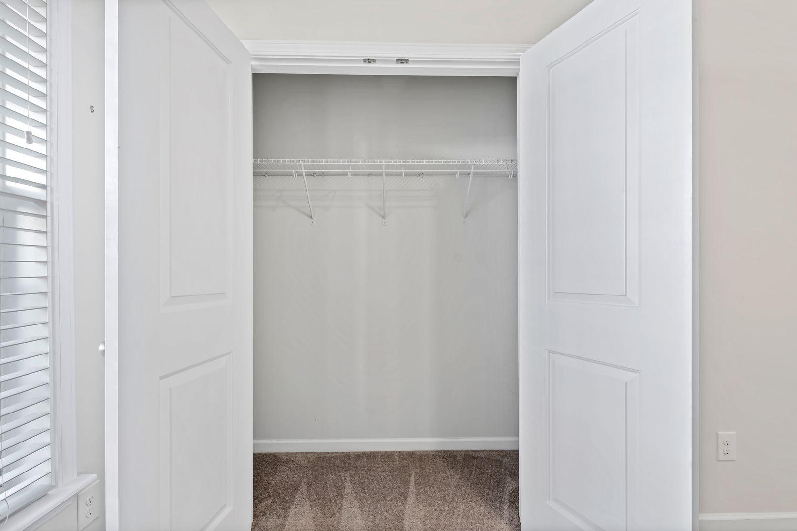 6103 Kayton Street Raleigh, NC 27616 - Photo 20 of 45 a view of walk in closet with empty racks