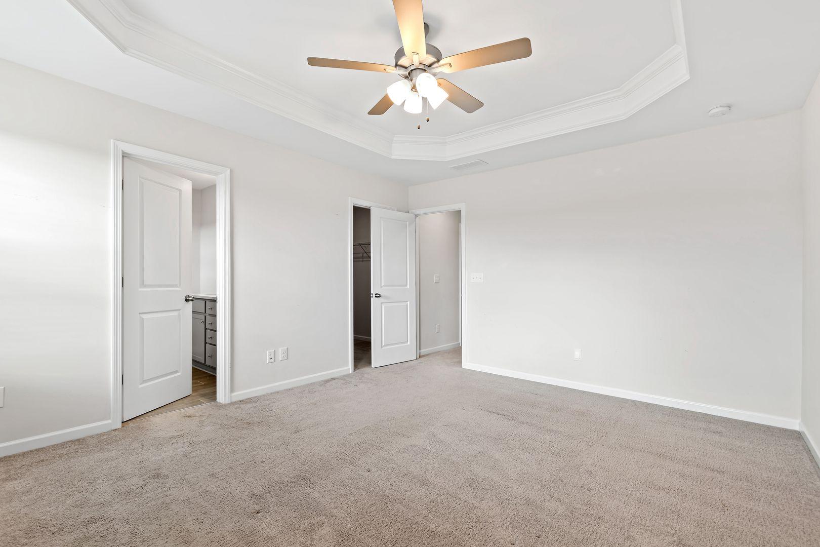 6103 Kayton Street Raleigh, NC 27616 - Photo 21 of 45 a view of an empty room with a ceiling fan