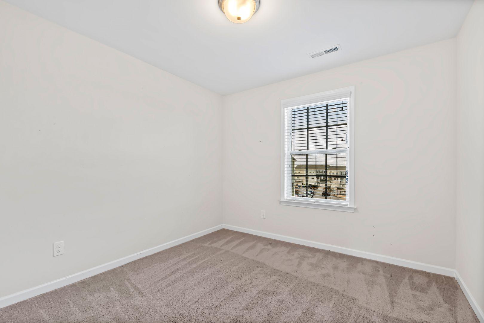 6103 Kayton Street Raleigh, NC 27616 - Photo 24 of 45 an empty room with a window