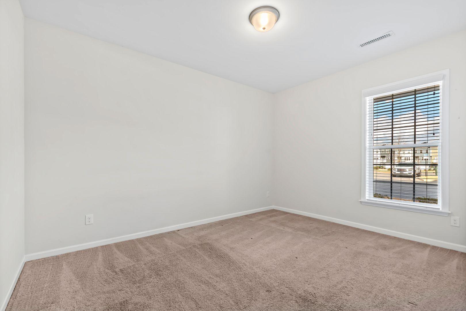 6103 Kayton Street Raleigh, NC 27616 - Photo 25 of 45 an empty room with a window