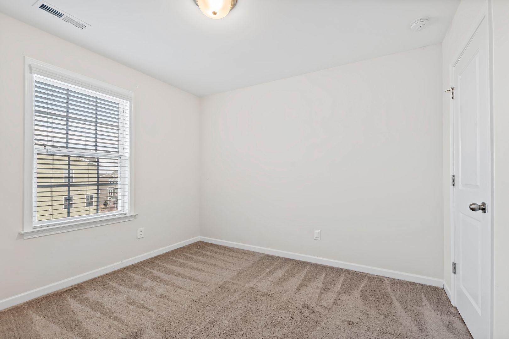 6103 Kayton Street Raleigh, NC 27616 - Photo 26 of 45 an empty room with a window