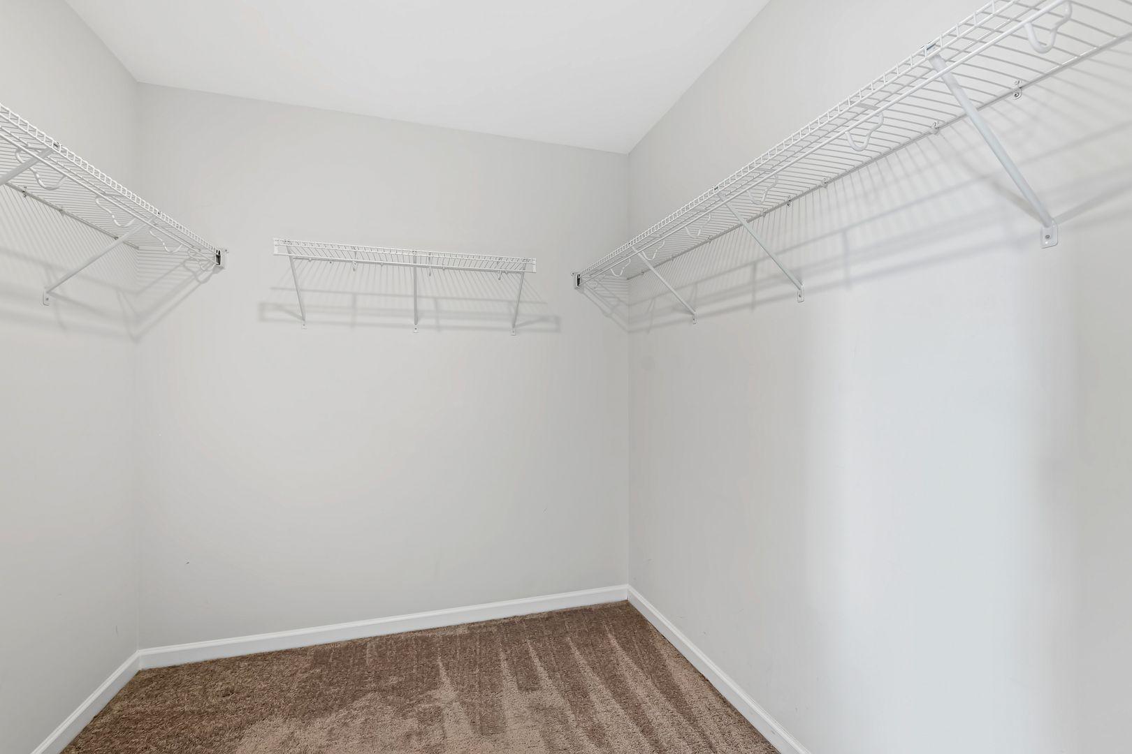 6103 Kayton Street Raleigh, NC 27616 - Photo 37 of 45 a view of a room with racks on the wall
