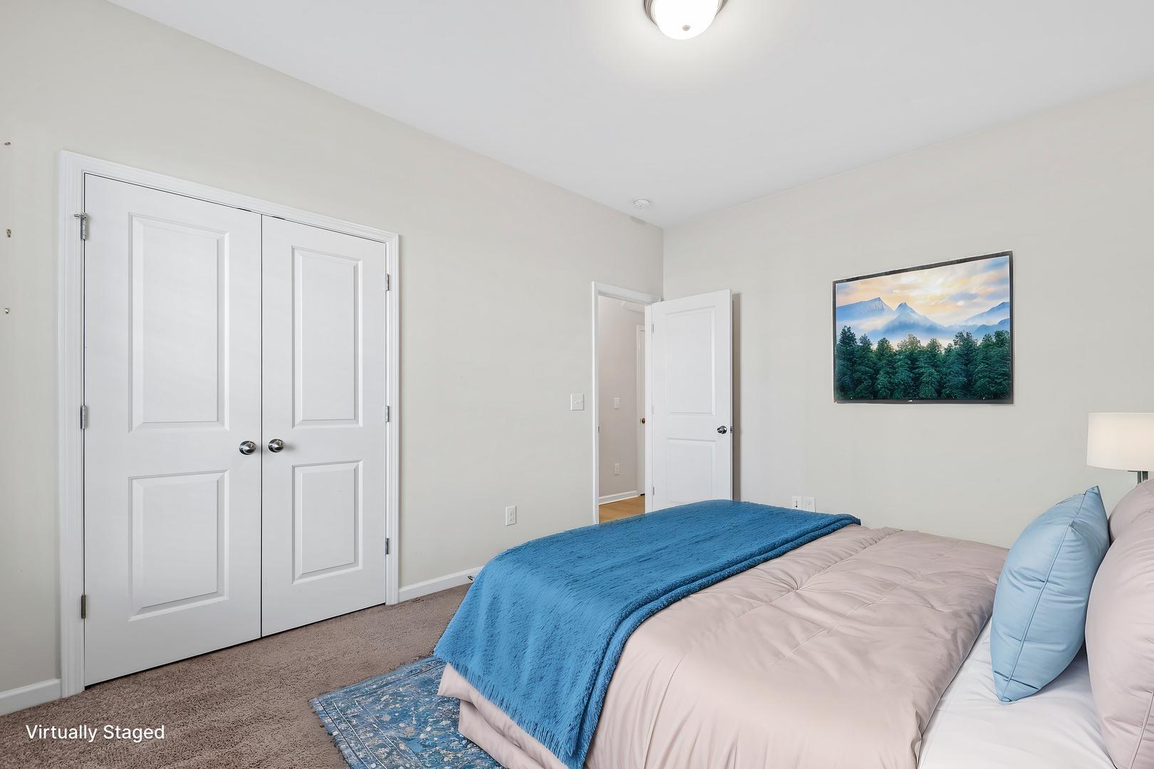 6103 Kayton Street Raleigh, NC 27616 - Photo 4 of 45 a bedroom with a bed and a painting on the wall