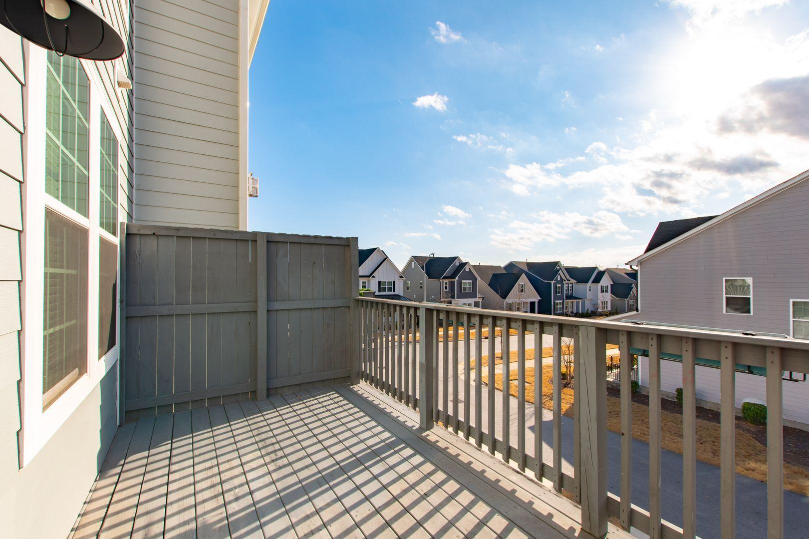 6103 Kayton Street Raleigh, NC 27616 - Photo 41 of 45 a view of a balcony with wooden floor