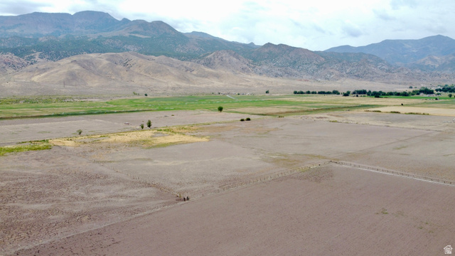 Undisclosed Address Monroe, UT 84754 - Photo 8 of 10 Expansive land parcel featuring a mix of cultivated and natural terrain, bordered by distant mountains