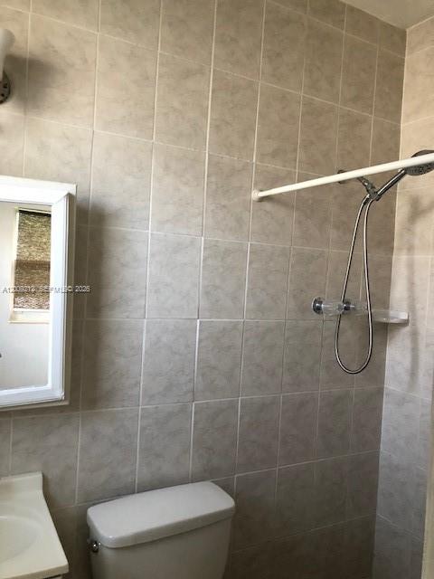 471 Southwest 10th Street, Unit 5 Miami, FL 33130 - Photo 4 of 10 a bathroom with a toilet and shower