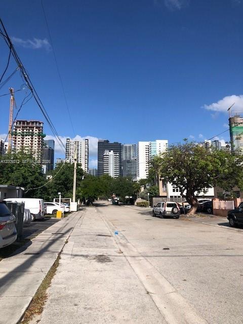 471 Southwest 10th Street, Unit 5 Miami, FL 33130 - Photo 9 of 10 a view of car parked on the side of a street