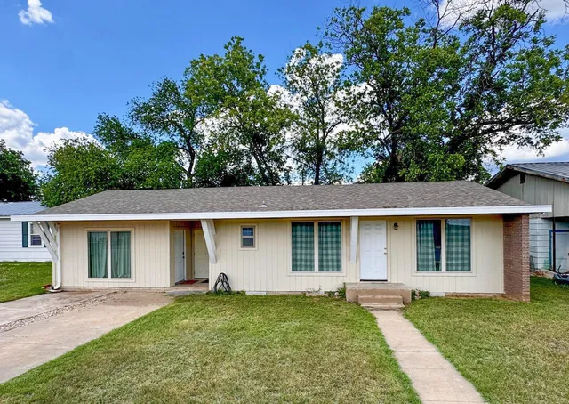 front view of a house and a yard