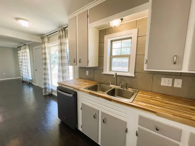 a kitchen with a sink and cabinets