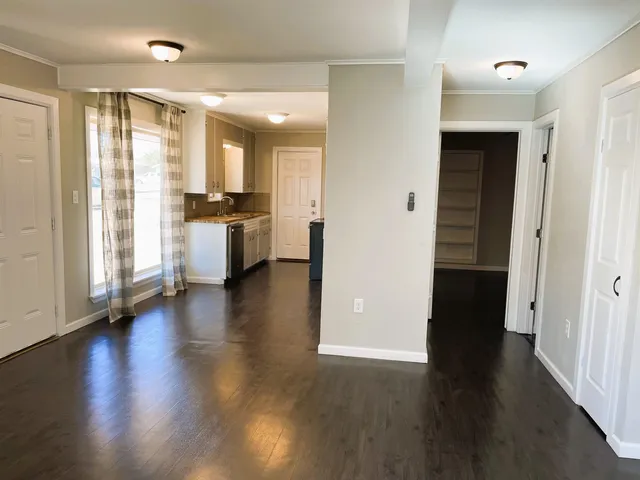 a view of a kitchen cabinets and wooden floor