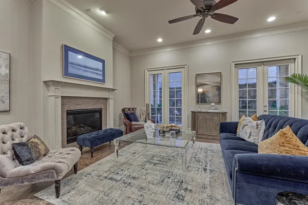 a living room with furniture and kitchen view