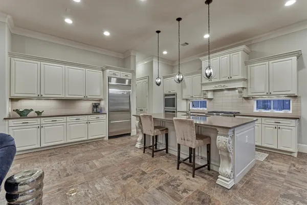 a kitchen with granite countertop a stove and a sink