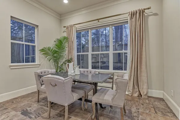 a living room with furniture and a ceiling fan