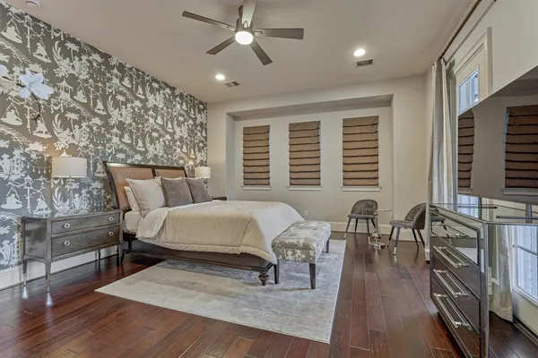 a spacious bathroom with a double vanity sink a large mirror and a shower