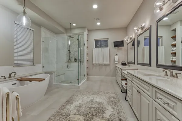 a bathroom with a bathtub and shower