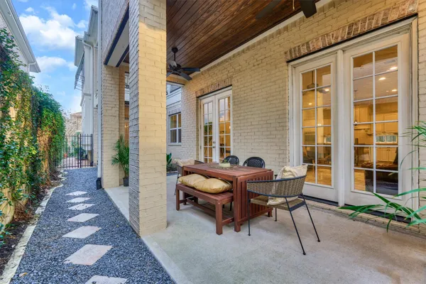 a balcony with a book table and chairs