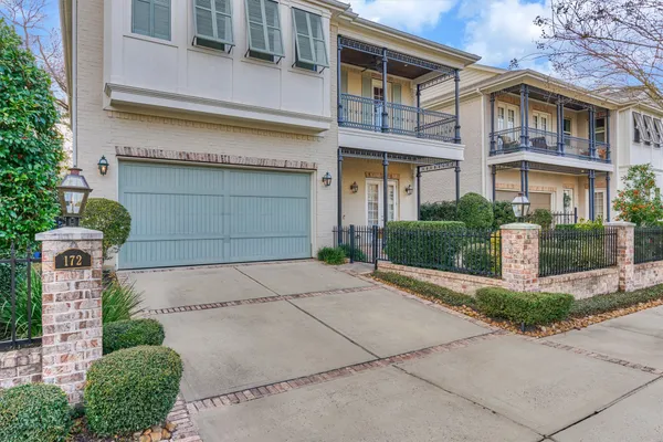 a front view of a house with outdoor seating
