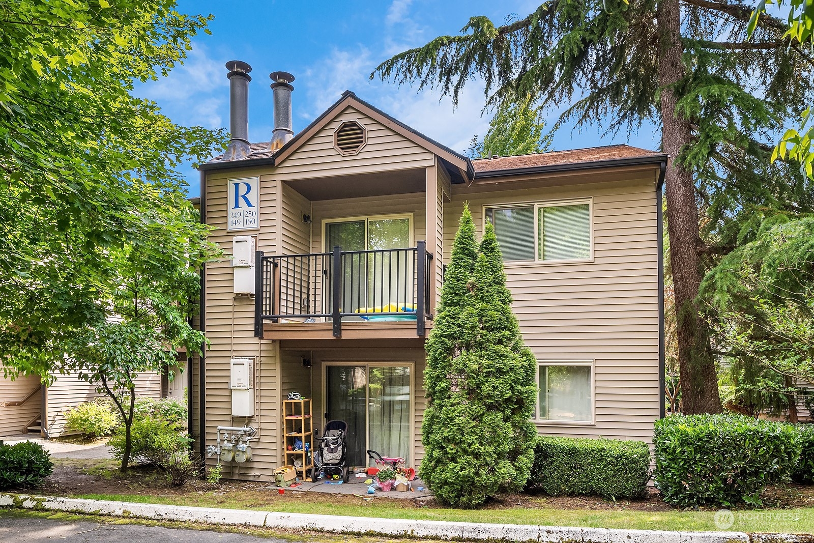 9805 Avondale Road Northeast, Unit R149 Redmond, WA 98052 - Photo 1 of 21 a front view of a house with garden