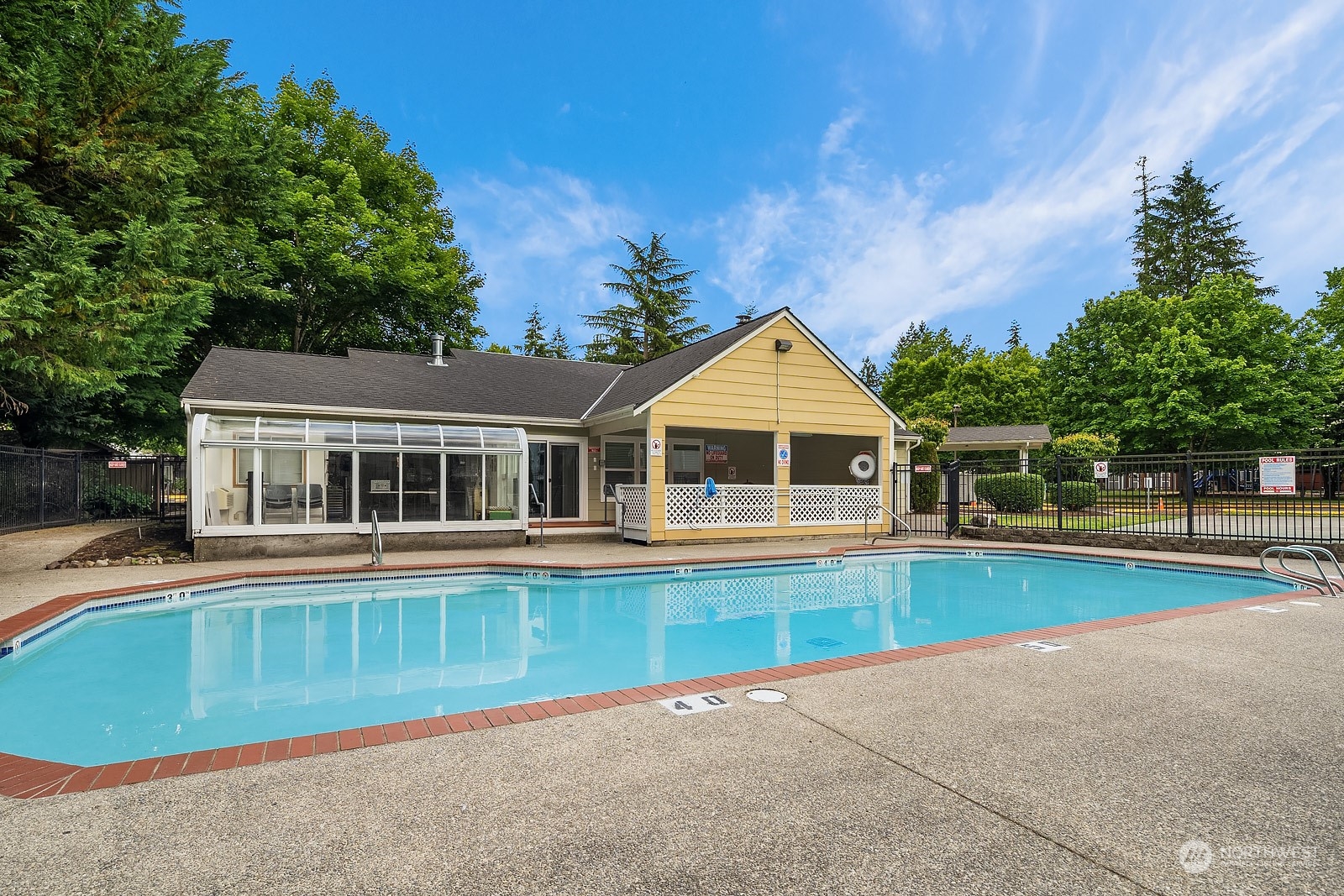 9805 Avondale Road Northeast, Unit R149 Redmond, WA 98052 - Photo 19 of 21 a front view of a house with a yard and trees
