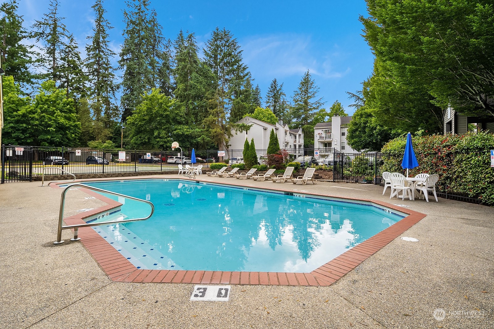 9805 Avondale Road Northeast, Unit R149 Redmond, WA 98052 - Photo 20 of 21 a view of a swimming pool with outdoor seating