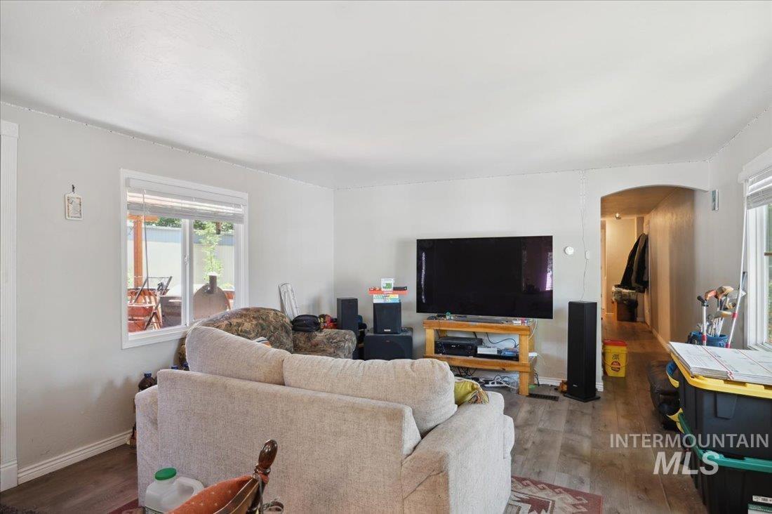 790 North Riviera Drive Boise, ID 83703 - Photo 4 of 15 Living area with arched walkways and wood finished floors