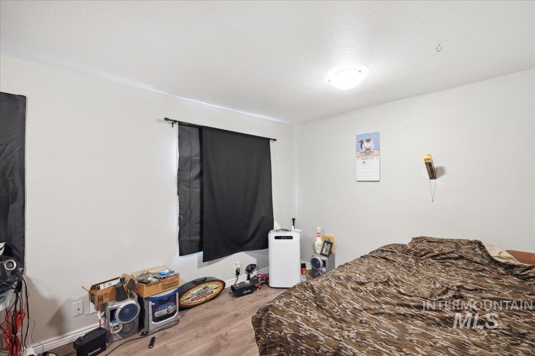 790 North Riviera Drive Boise, ID 83703 - Photo 10 of 15 Bedroom with wood finished floors