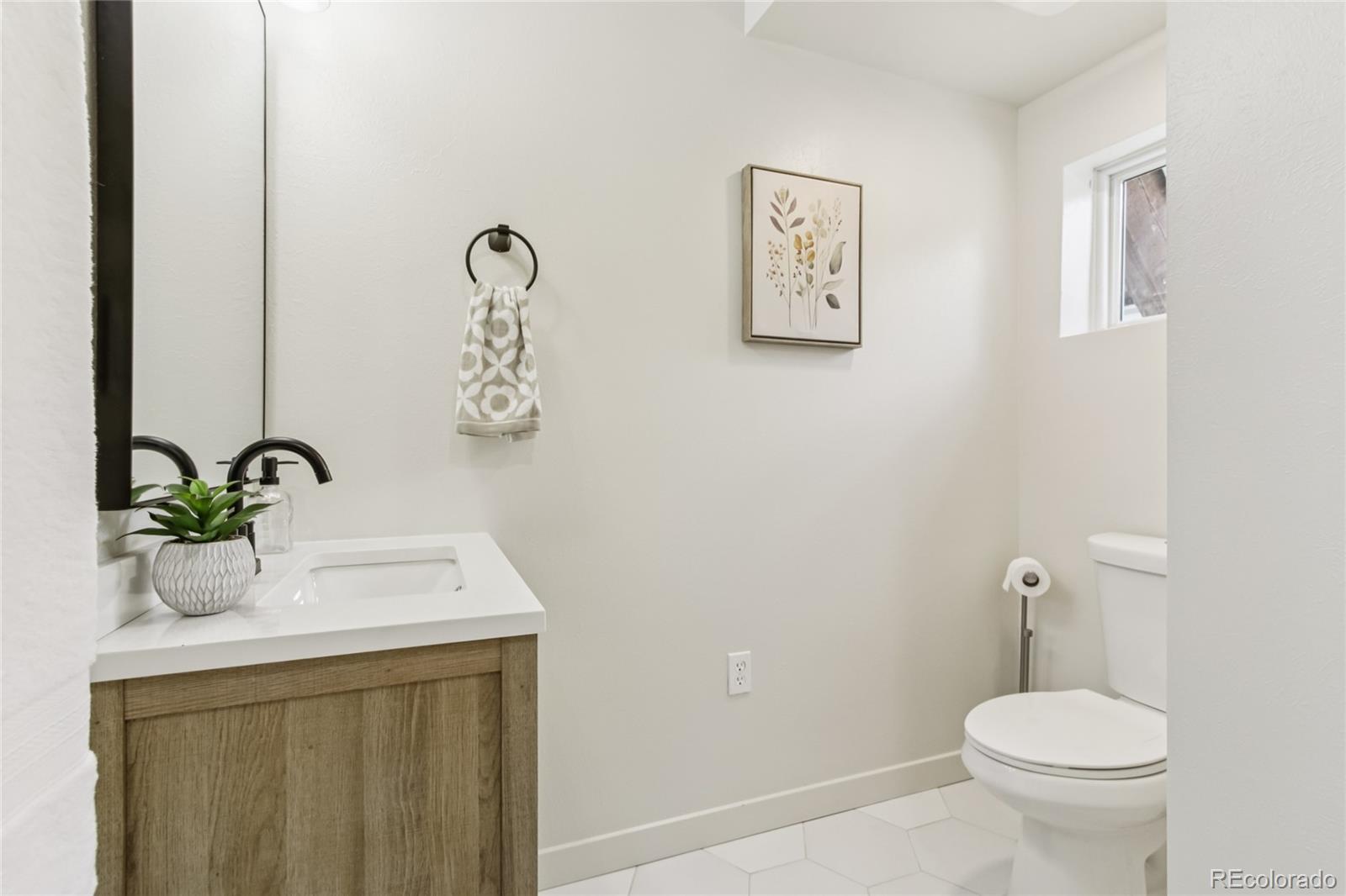 1472 Sinton Road Evergreen, CO 80439 - Photo 8 of 39 a bathroom with a sink mirror and toilet