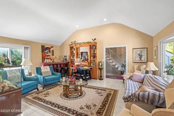 a living room with furniture and a table