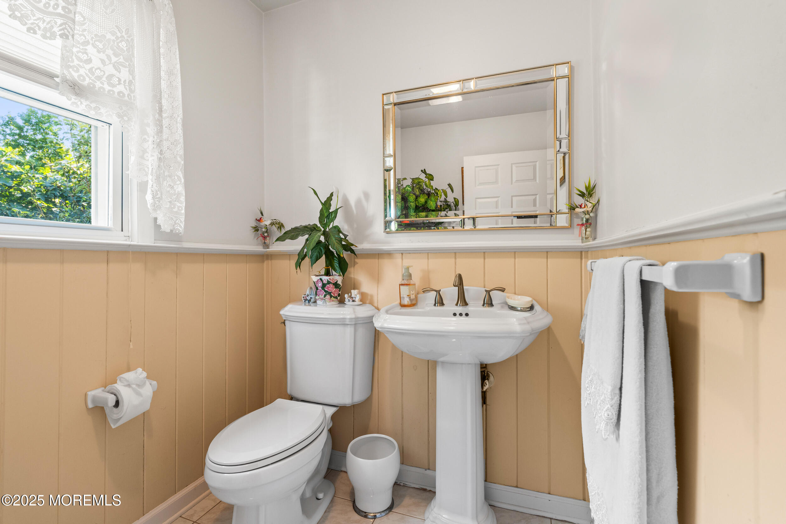 514 Deal Road Asbury Park, NJ 07712 - Photo 21 of 36 a bathroom with a sink and mirror with toilet