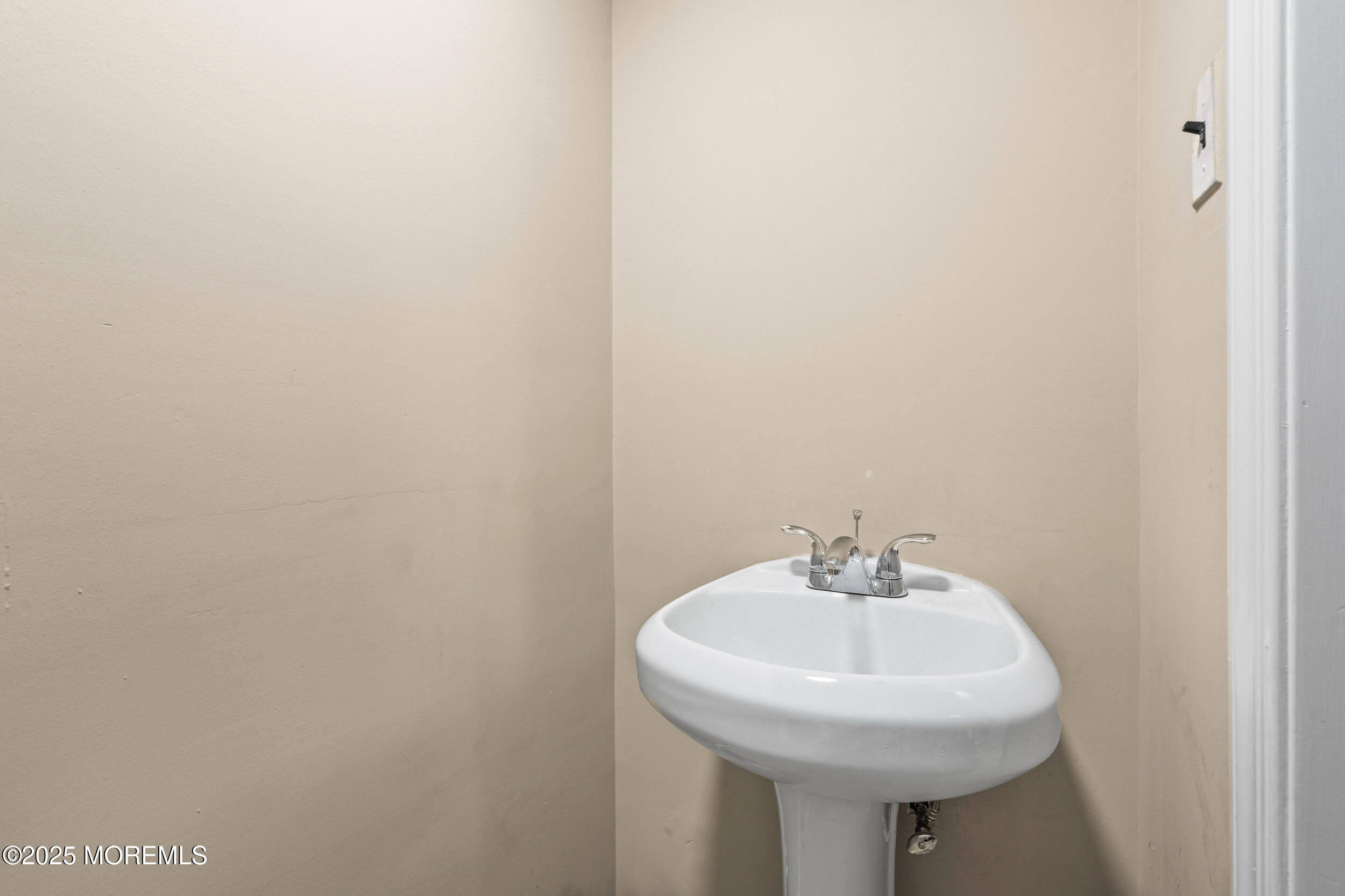 514 Deal Road Asbury Park, NJ 07712 - Photo 24 of 36 a bathroom with a sink and a mirror