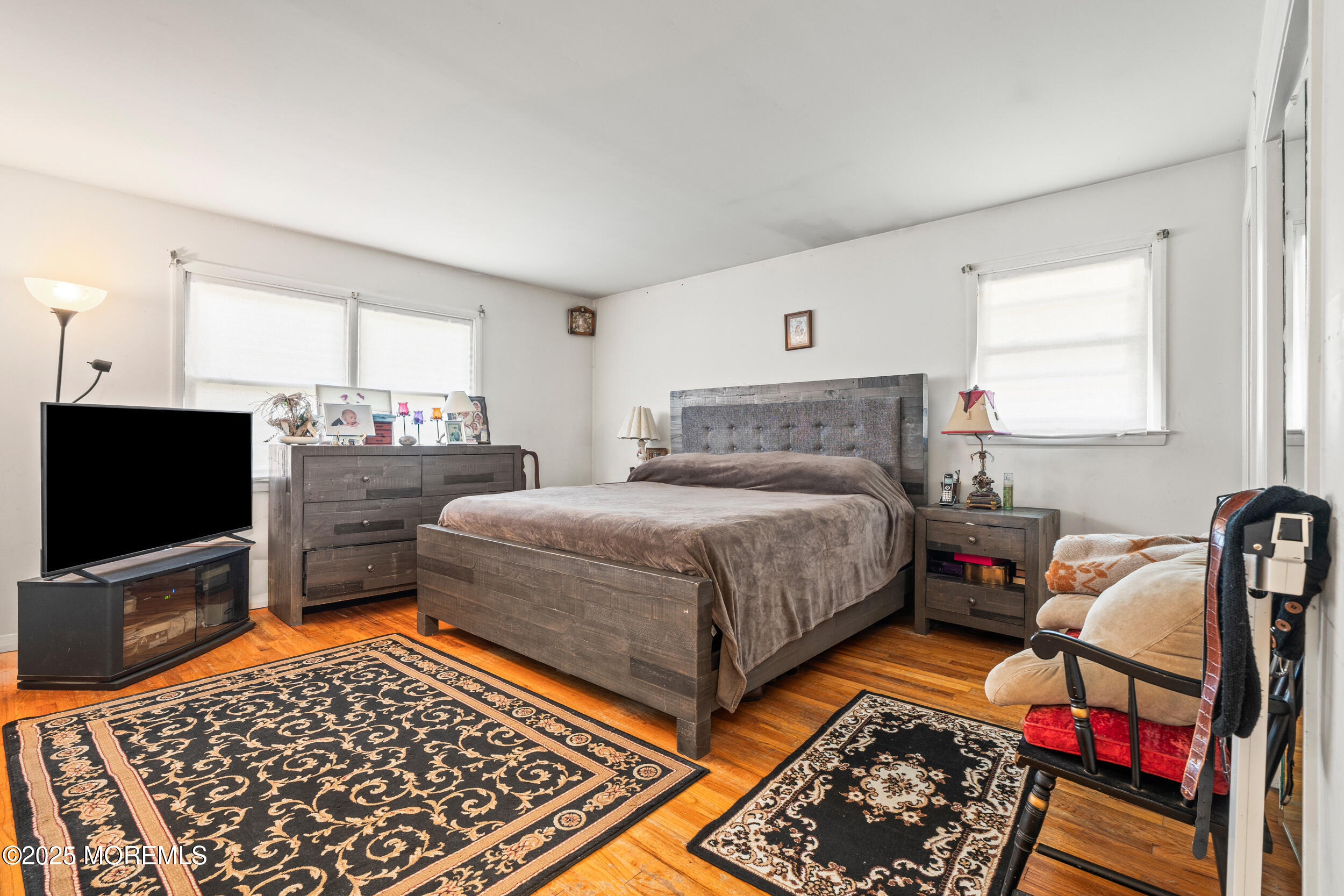 514 Deal Road Asbury Park, NJ 07712 - Photo 26 of 36 a bedroom with bed and flat screen tv