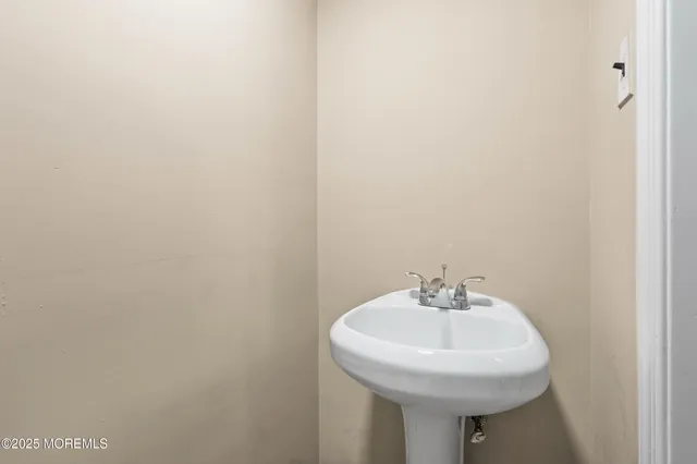 a view of a patio with table and chairs and potted plants