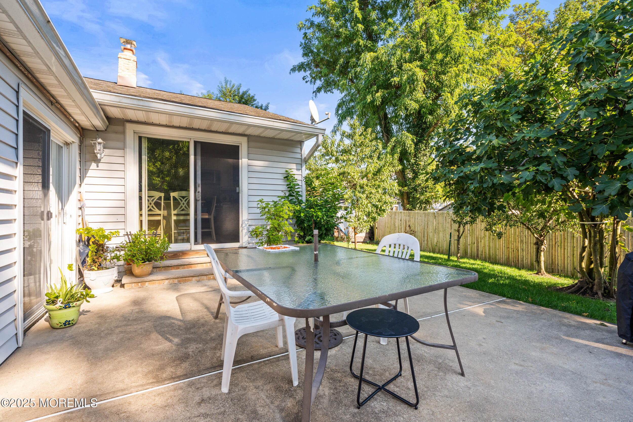 514 Deal Road Asbury Park, NJ 07712 - Photo 32 of 36 a view of a patio with table and chairs and potted plants