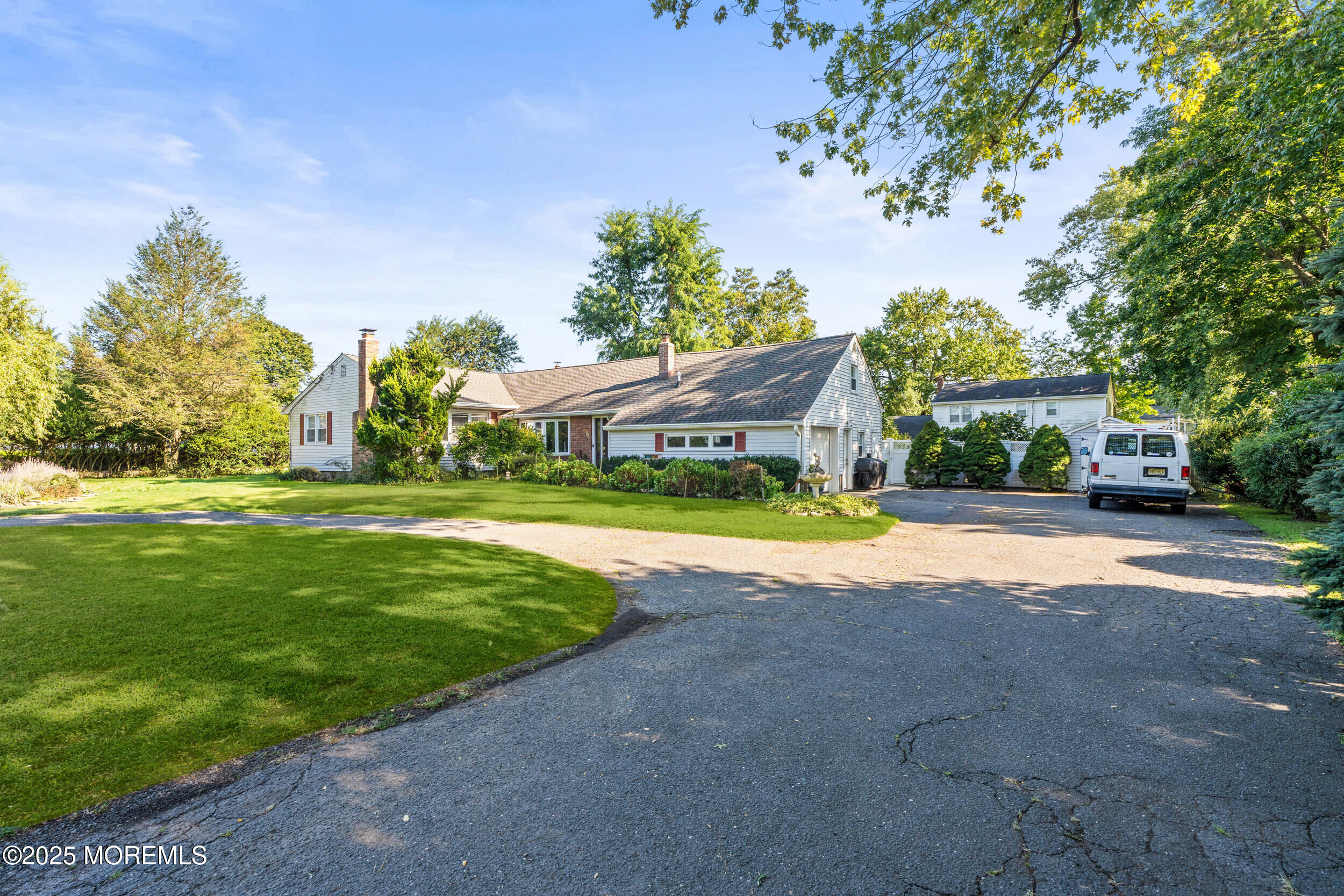 514 Deal Road Asbury Park, NJ 07712 - Photo 33 of 36 a view of a house with a big yard and large trees