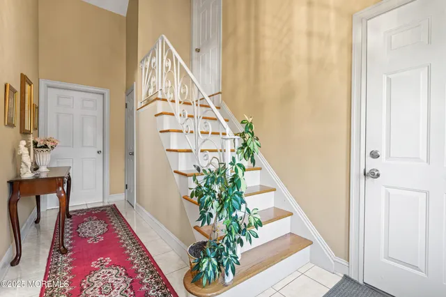 a view of an entryway with wooden floor