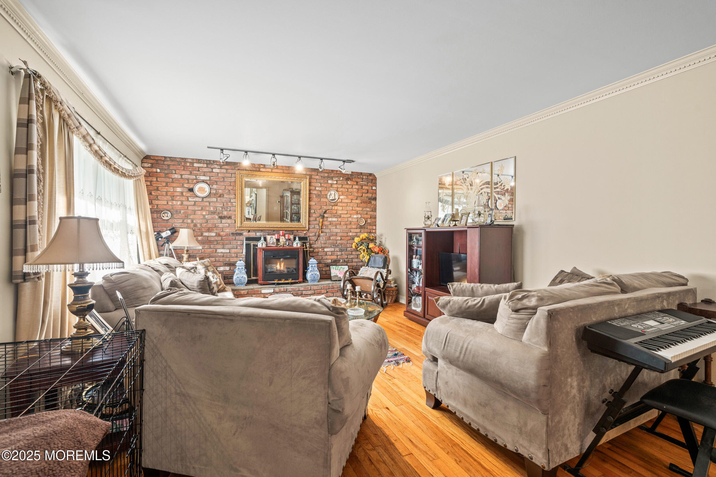 514 Deal Road Asbury Park, NJ 07712 - Photo 7 of 36 a living room with furniture and a large window