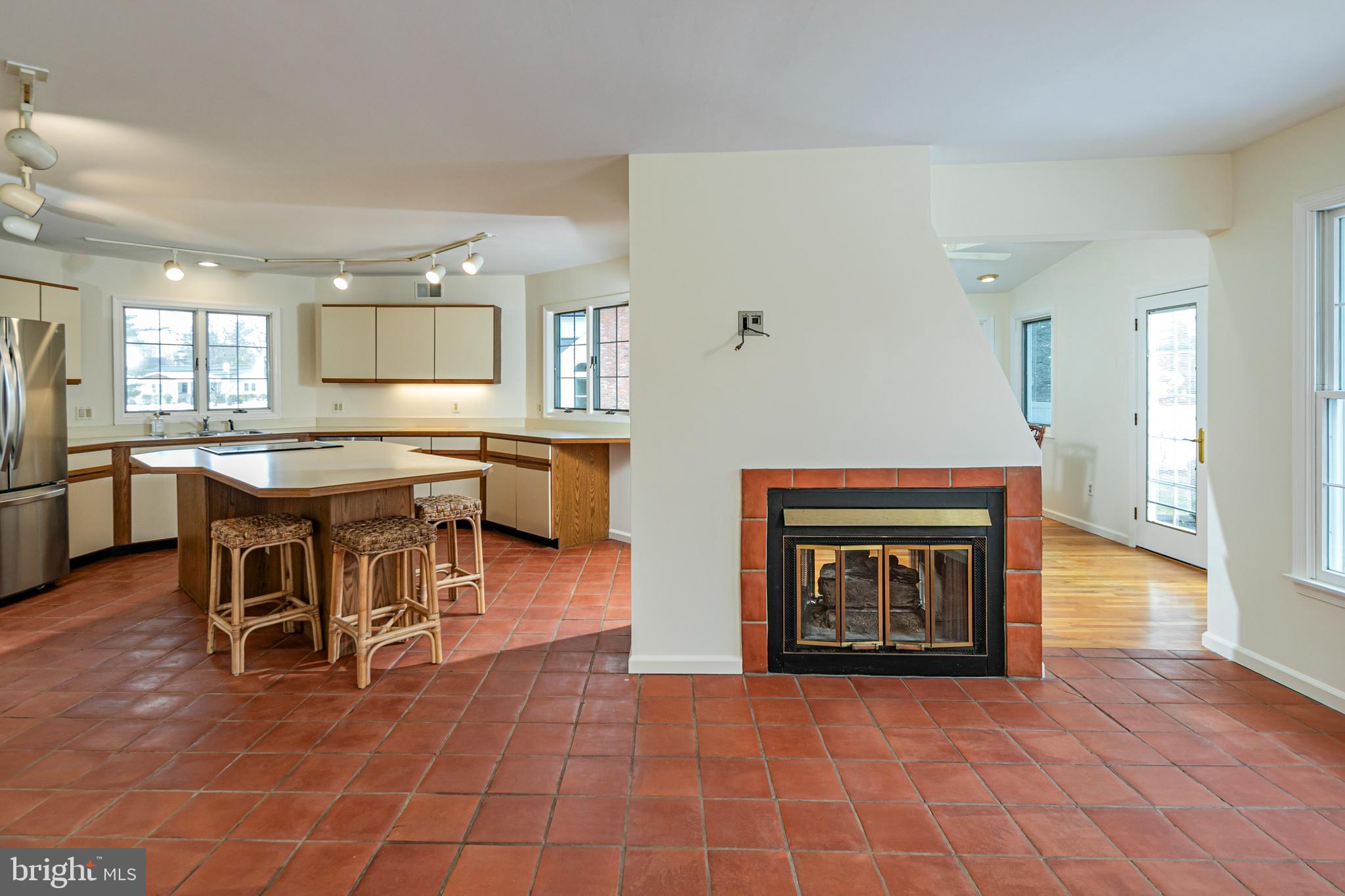 30 Baldwin Street Pennington, NJ 08534 - Photo 13 of 37 a view of a dining room with furniture and a fireplace