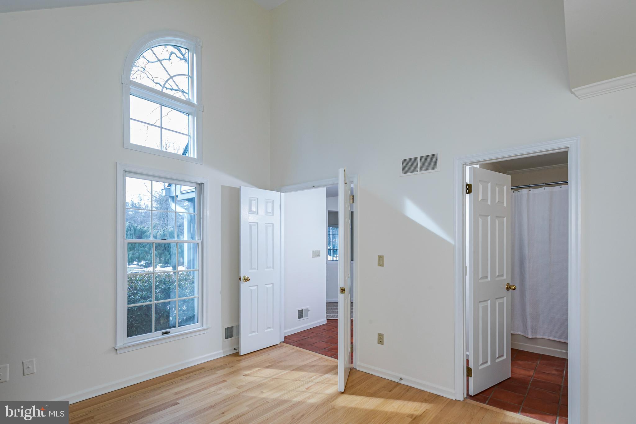 30 Baldwin Street Pennington, NJ 08534 - Photo 20 of 34 an empty room with wooden floor cabinet and windows