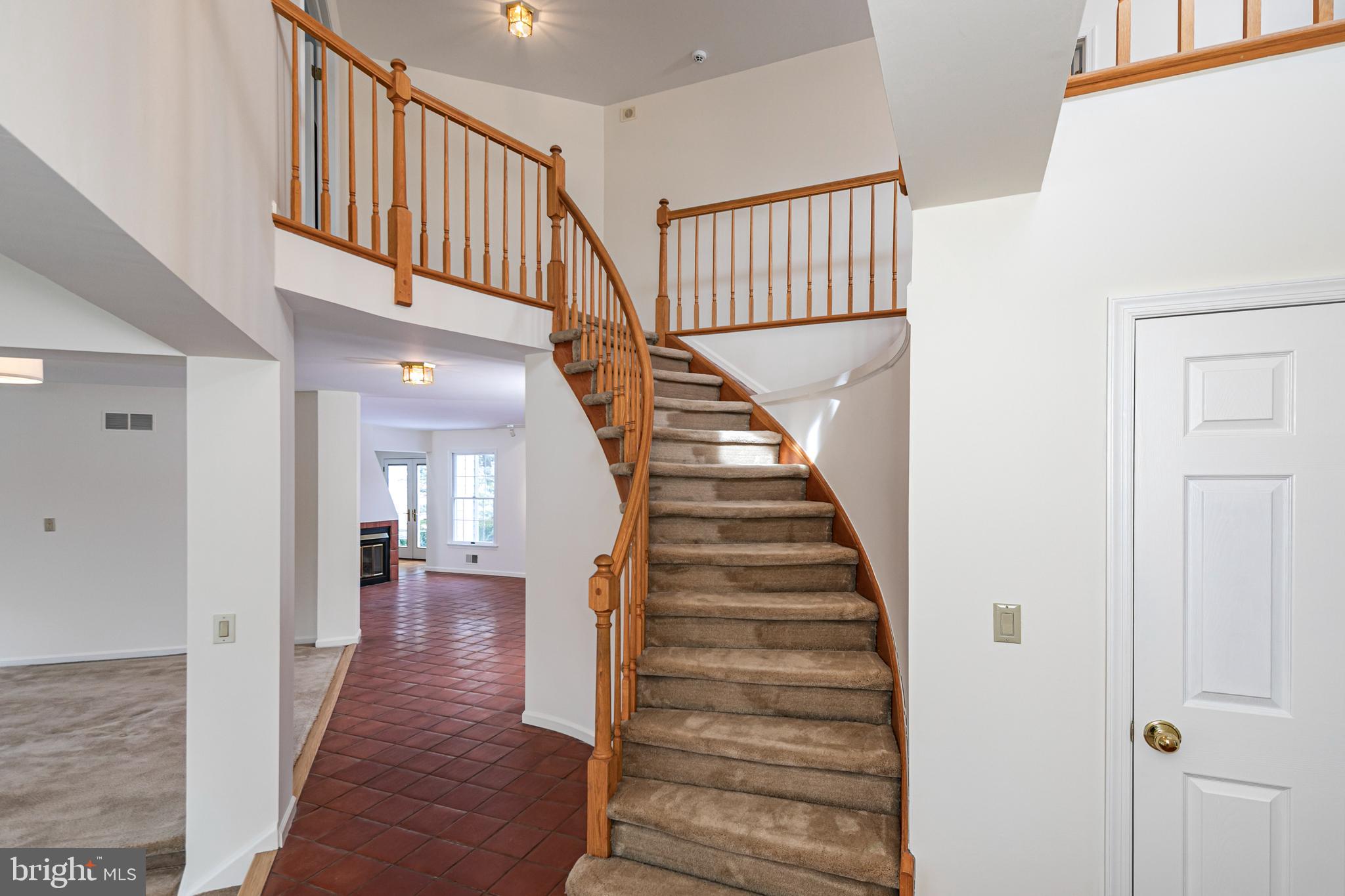 30 Baldwin Street Pennington, NJ 08534 - Photo 9 of 37 a view of staircase with lots of frames on wall and wooden floor