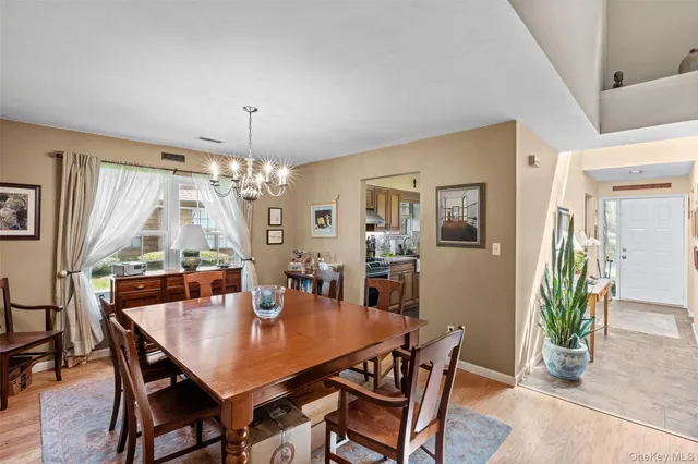 a large kitchen with stainless steel appliances granite countertop a sink stove and cabinets